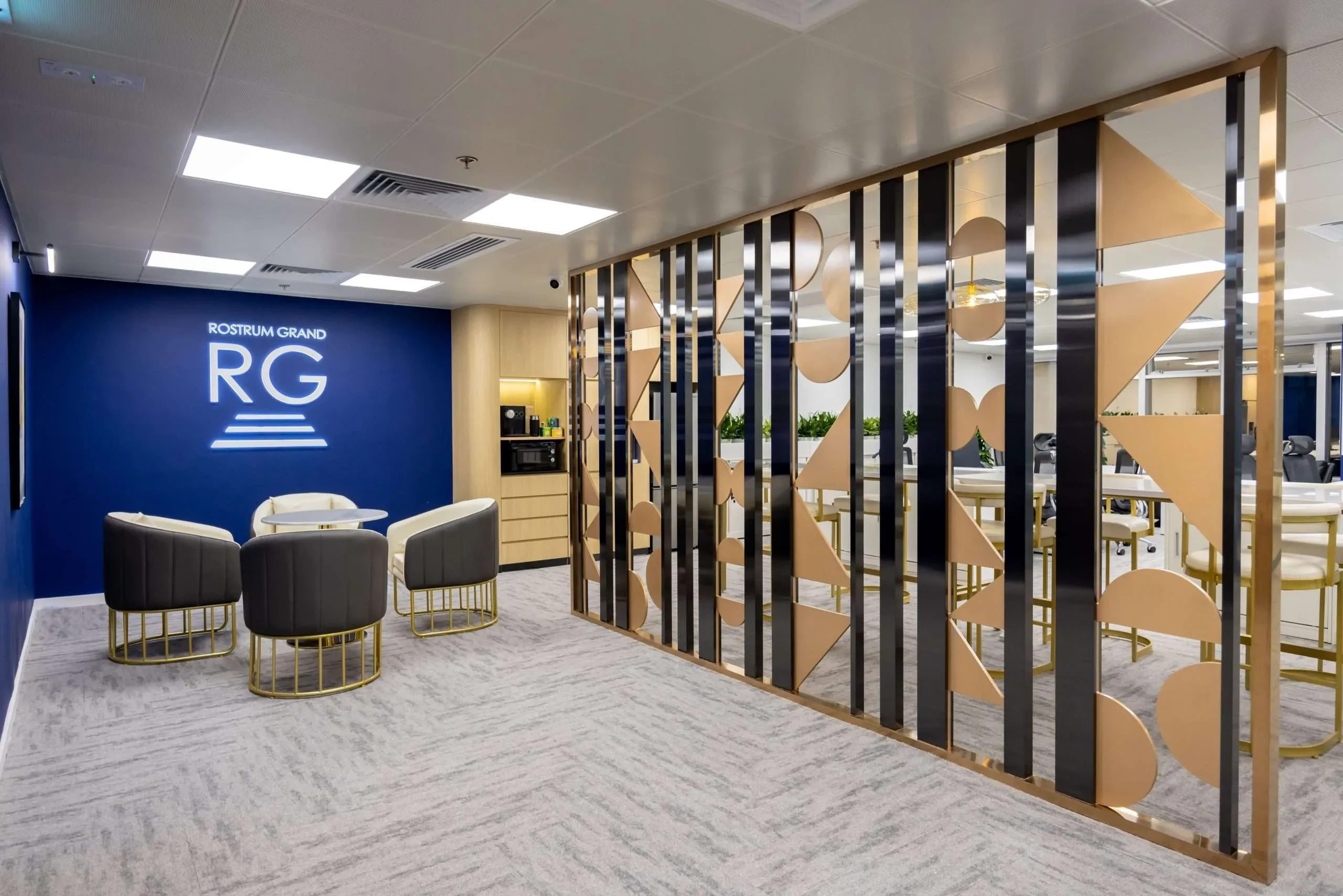 MJPM-designed workplace reception with bespoke screening, lounge seating and meeting spaces